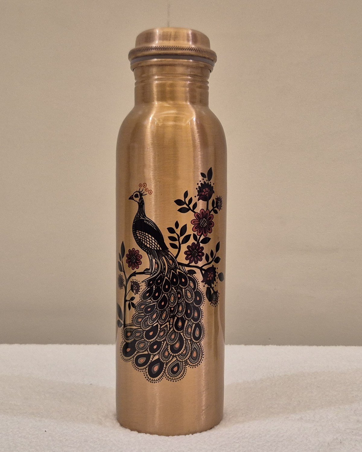 A DPitara pure copper bottle with a decorative pattern